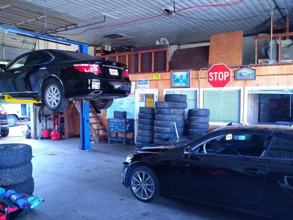 Service bay with tires stacked along the wall